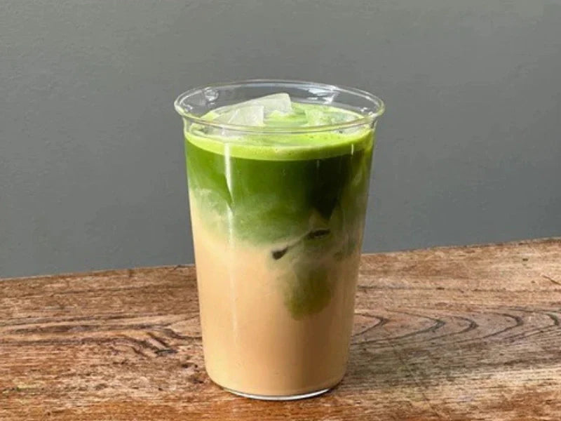 london fog matcha latte with earl grey tea and oat milk layered drink