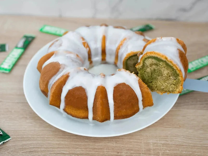 marbled matcha bundt cake with green swirl and icing glaze